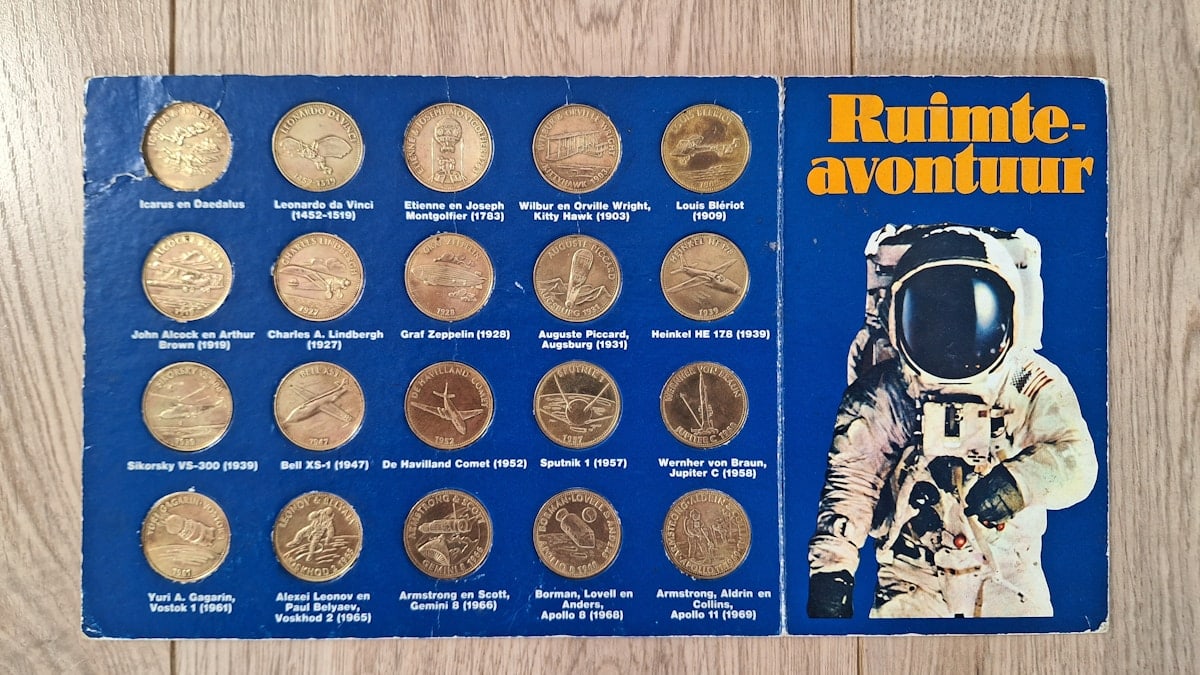 Blue display of space-themed tokens and an astronaut illustration.